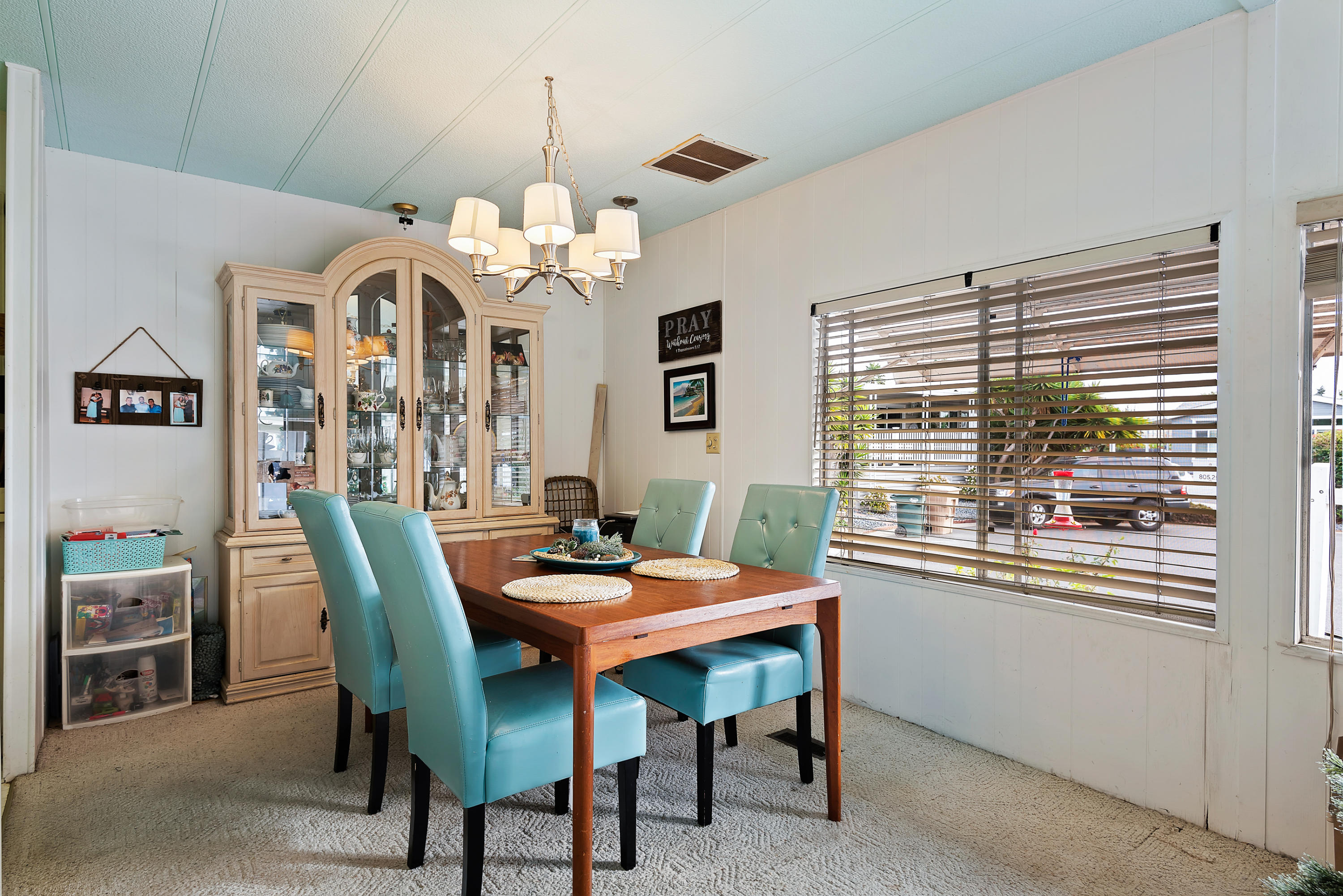 6180 Via Real, Unit 21 Carpinteria, CA 93013 - Photo 5 of 14 a dining room with furniture a chandelier and window