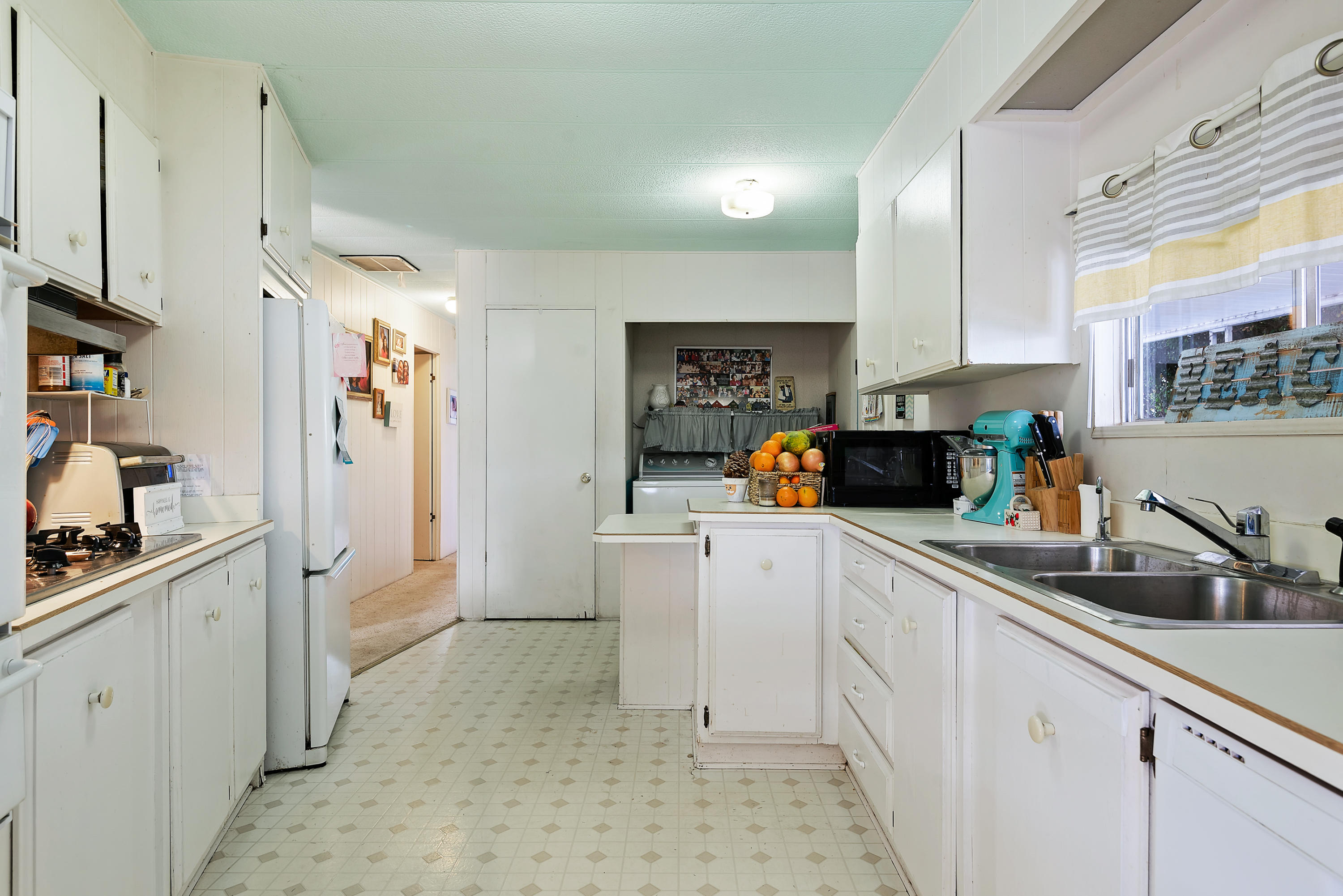 6180 Via Real, Unit 21 Carpinteria, CA 93013 - Photo 6 of 14 a kitchen with a sink cabinets and appliances