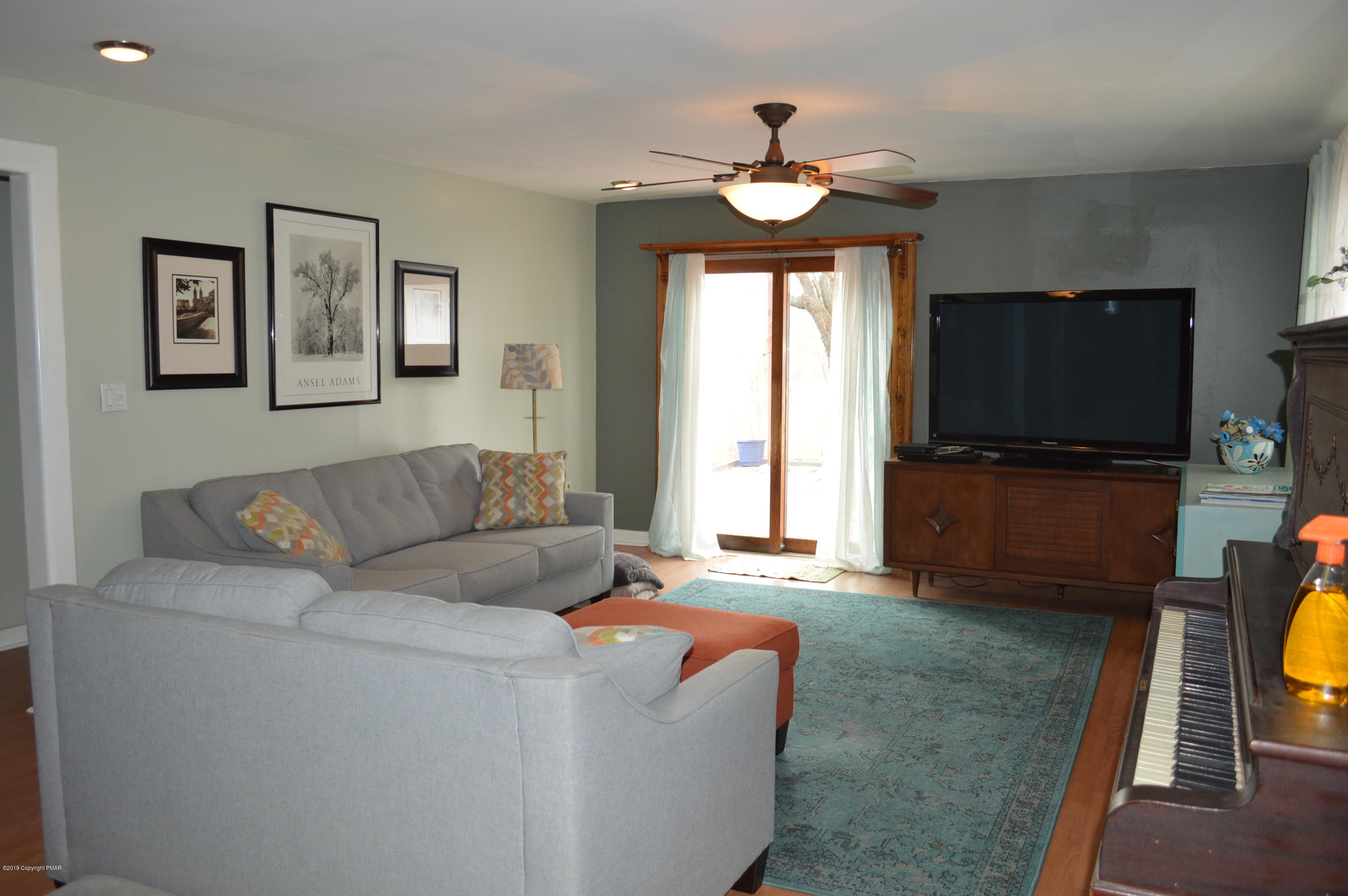 829 Gilbert Road Effort, PA 18330 - Photo 14 of 48 a living room with furniture and a flat screen tv