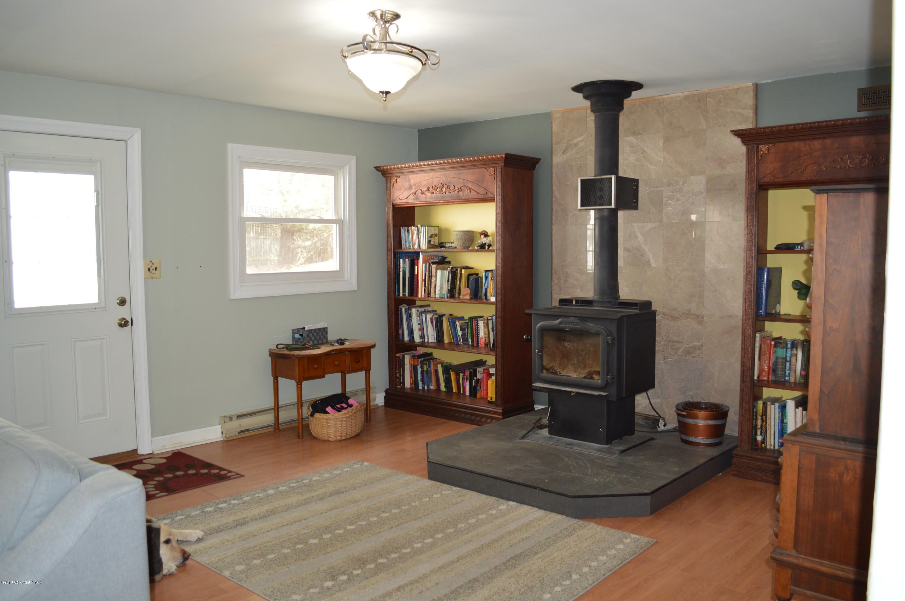 829 Gilbert Road Effort, PA 18330 - Photo 15 of 48 a living room with furniture and a flat screen tv