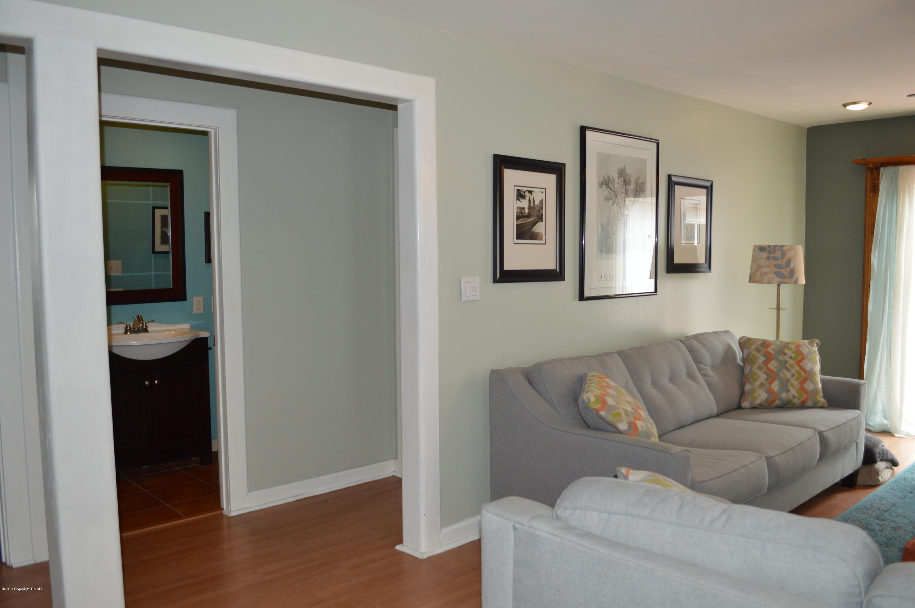 829 Gilbert Road Effort, PA 18330 - Photo 16 of 48 a living room with a couch and a view of living room