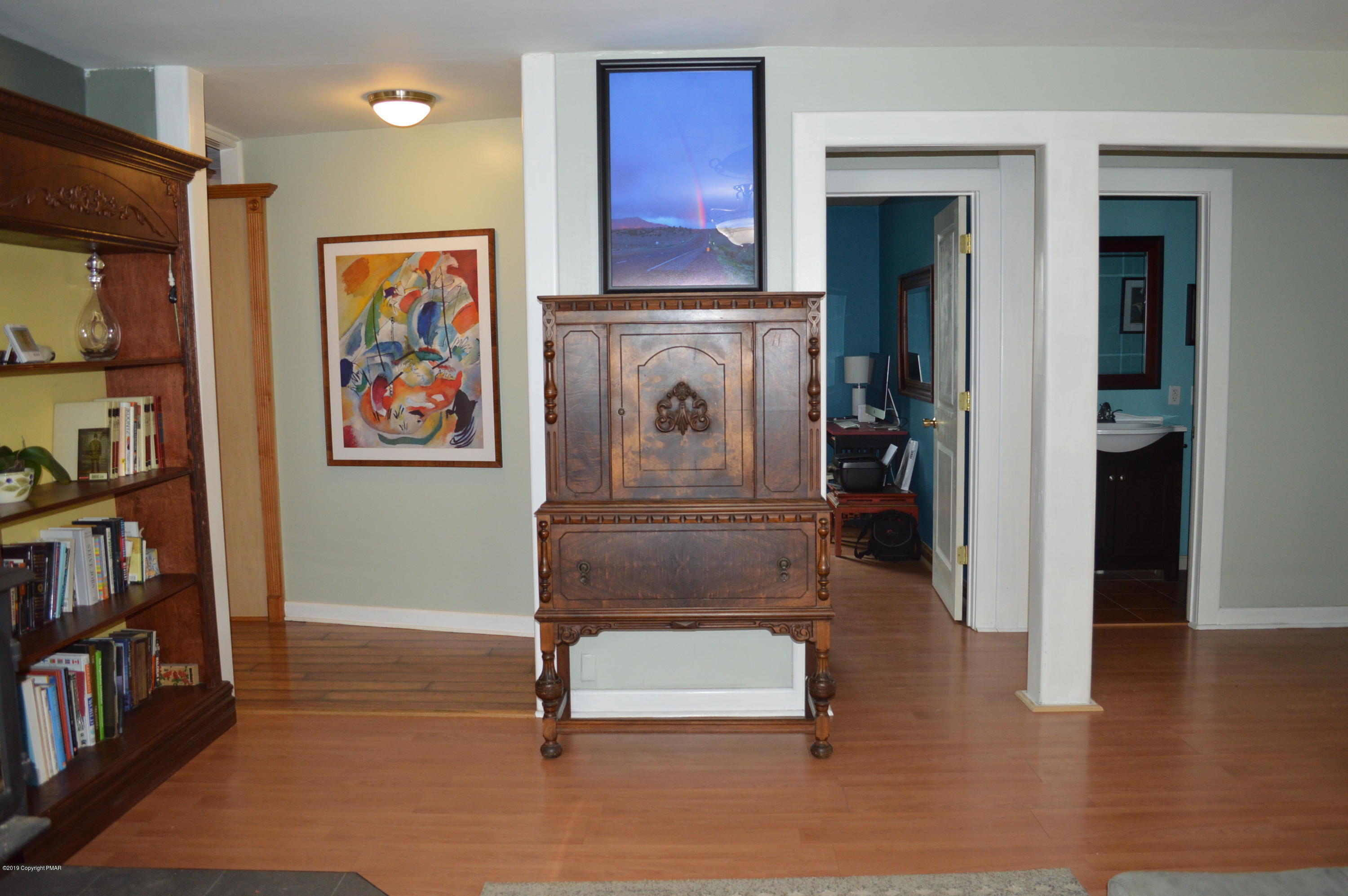 829 Gilbert Road Effort, PA 18330 - Photo 17 of 48 a room with furniture and a book shelf