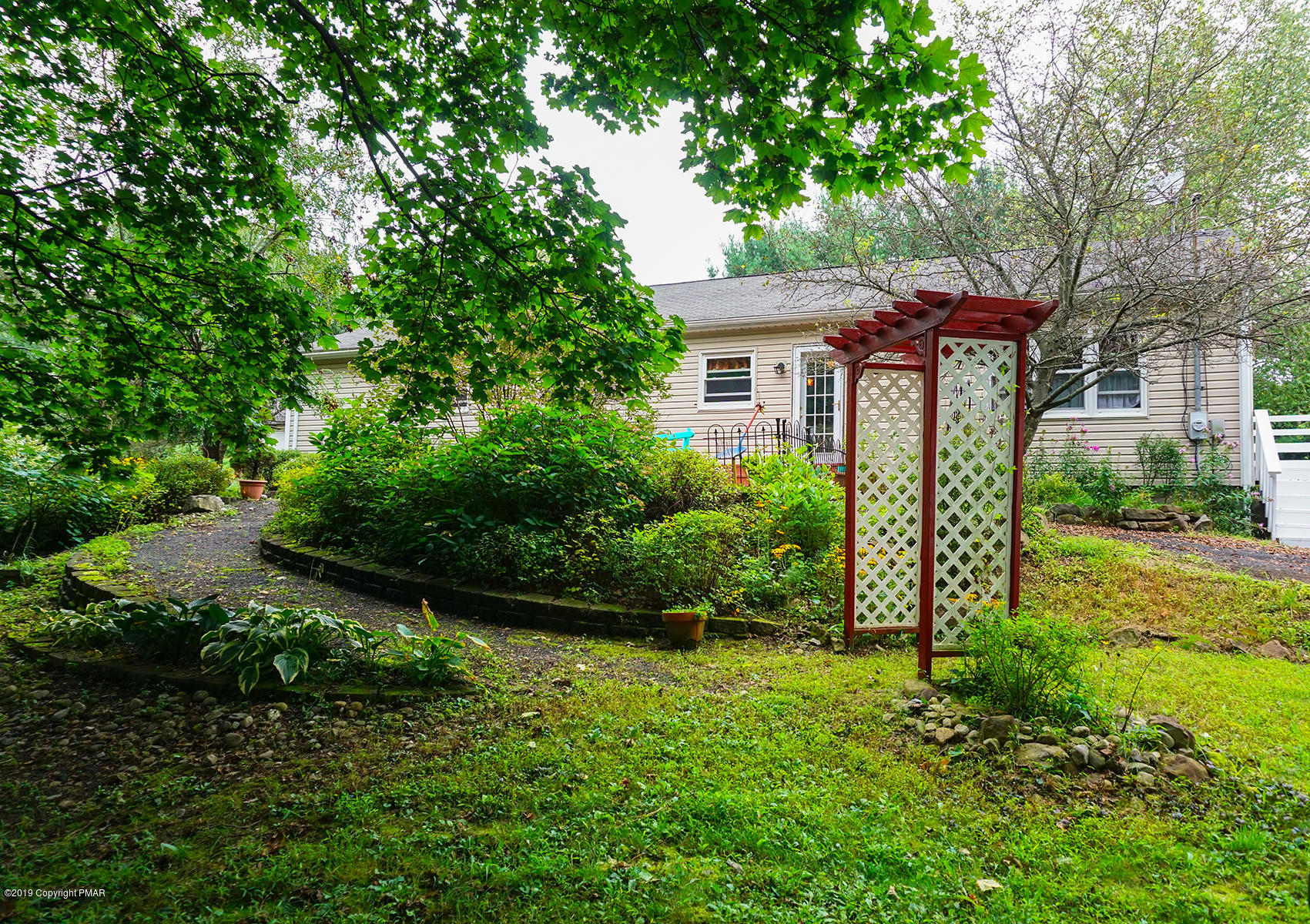 829 Gilbert Road Effort, PA 18330 - Photo 27 of 48 a front view of a house with garden