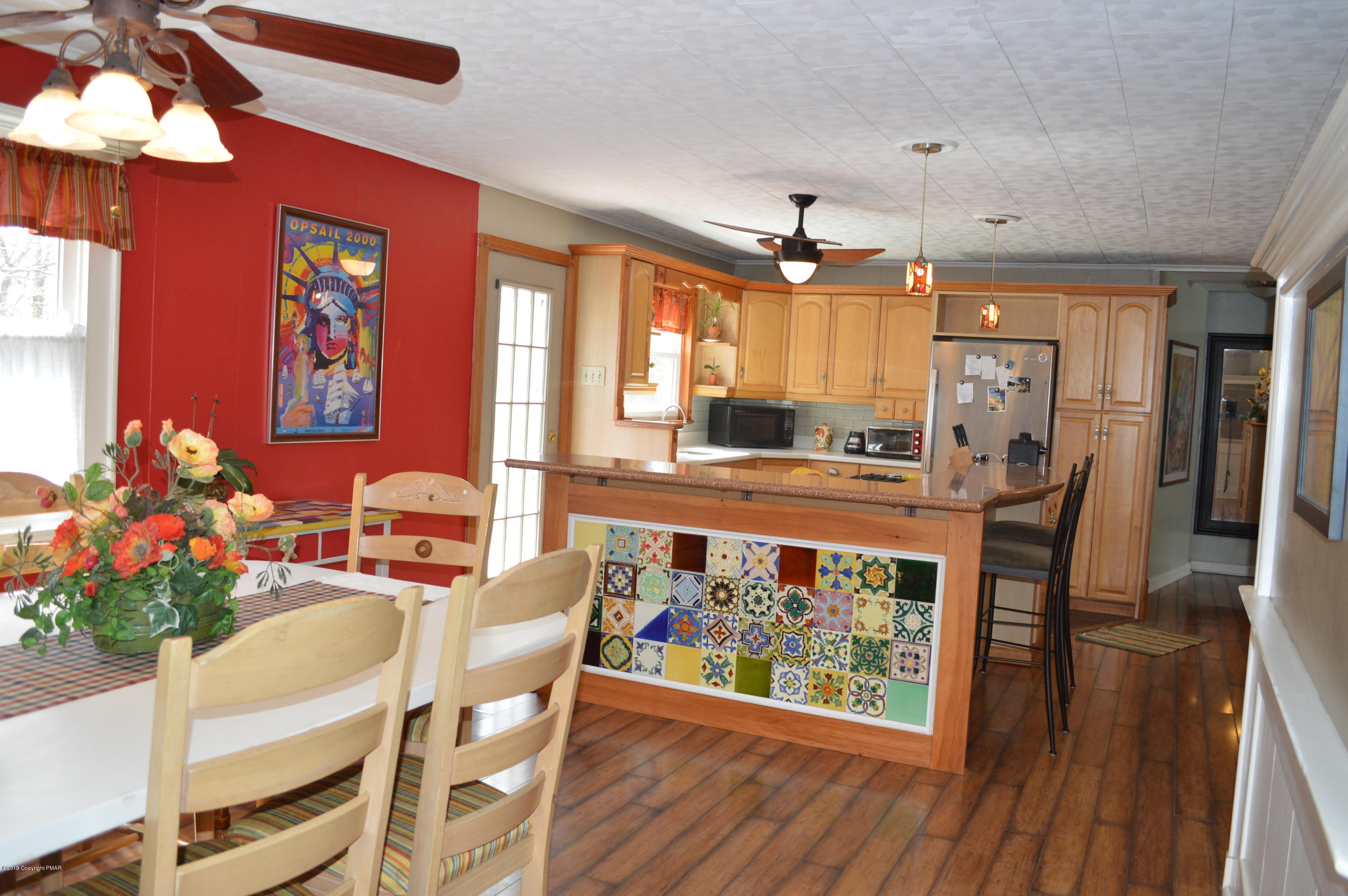 829 Gilbert Road Effort, PA 18330 - Photo 48 of 48 a view of a dining room with furniture and wooden floor