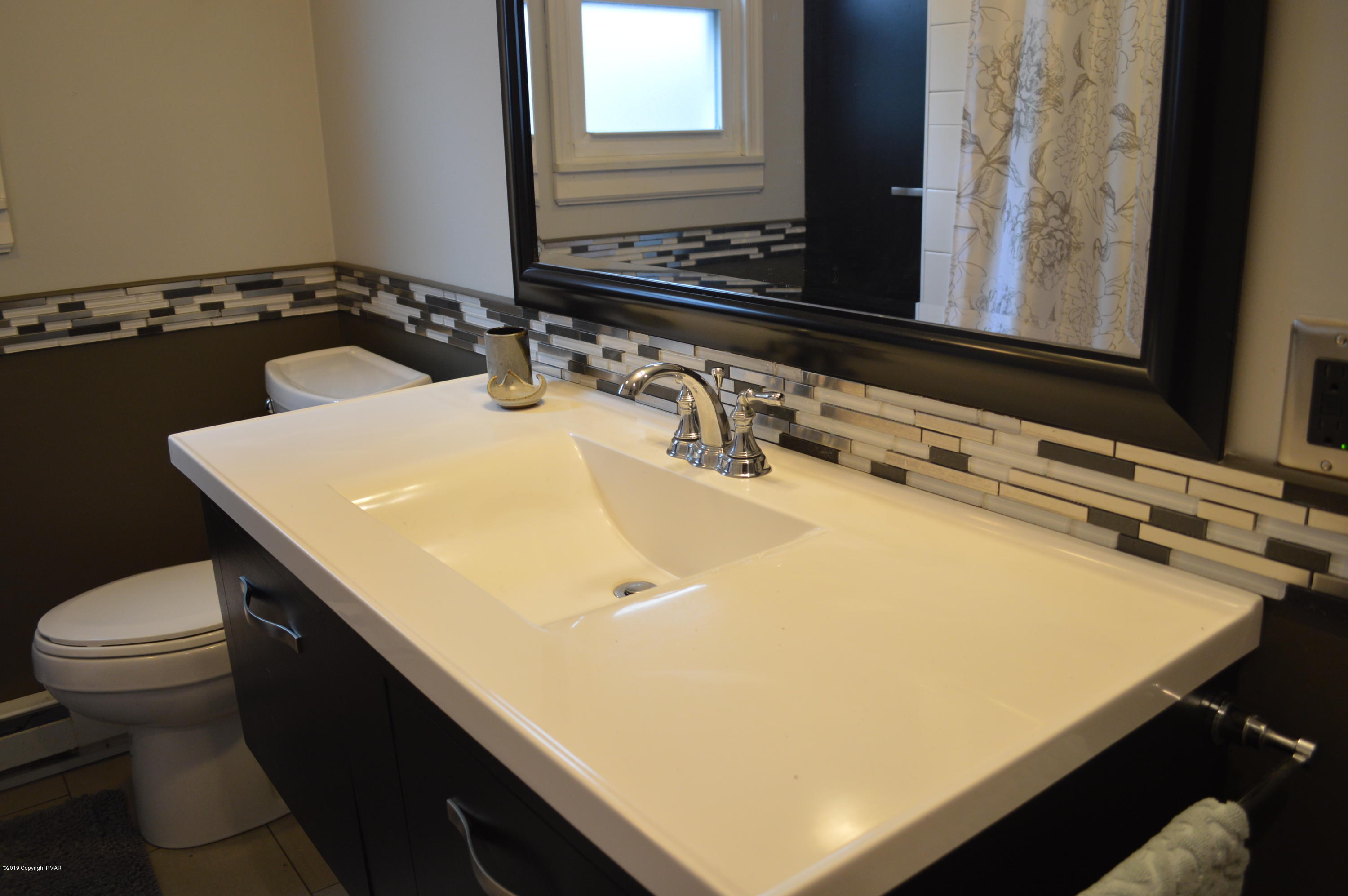 829 Gilbert Road Effort, PA 18330 - Photo 35 of 48 a bathroom with a sink and a mirror