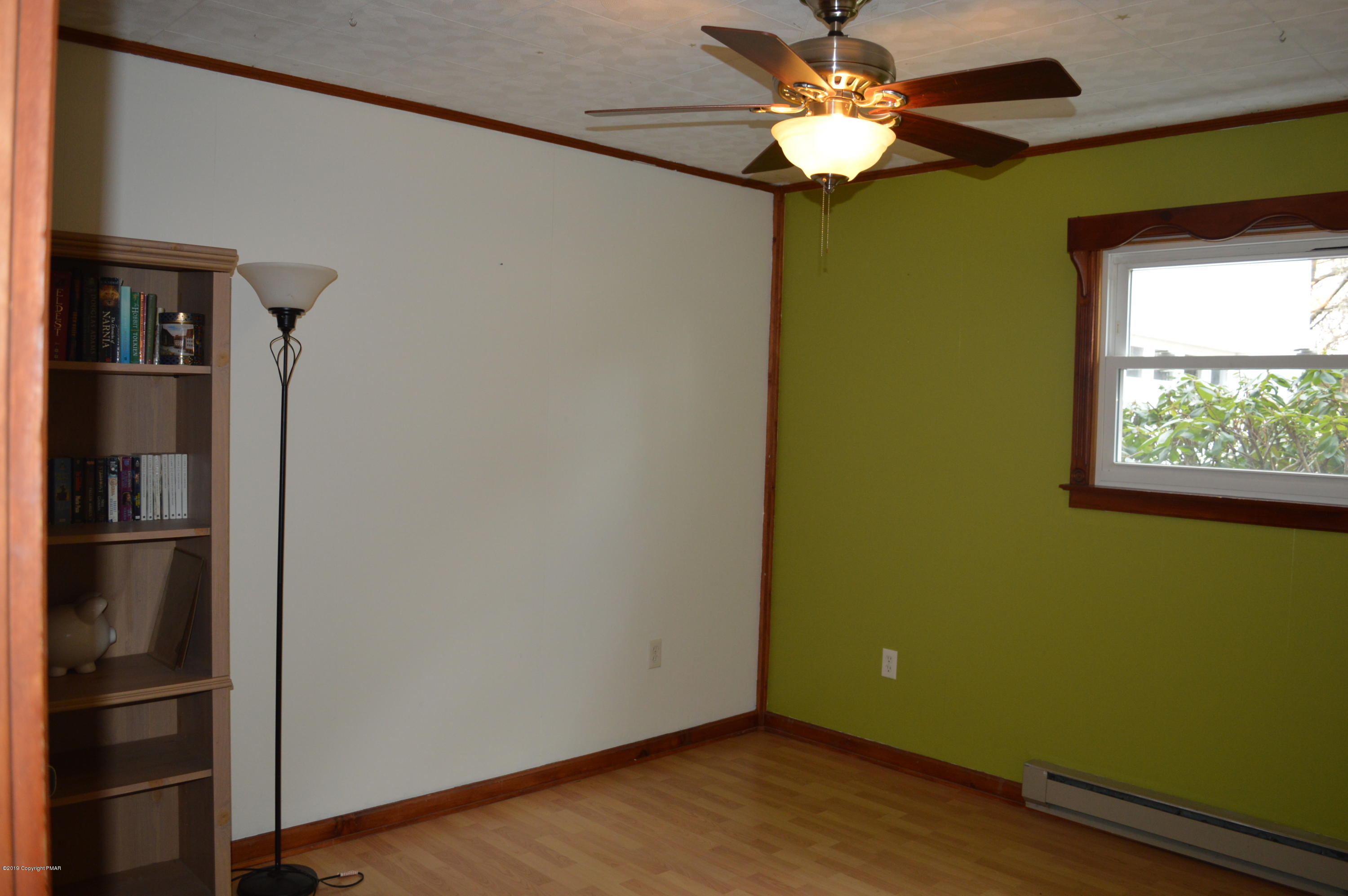 829 Gilbert Road Effort, PA 18330 - Photo 41 of 48 a view of a livingroom with a chandelier fan and a window