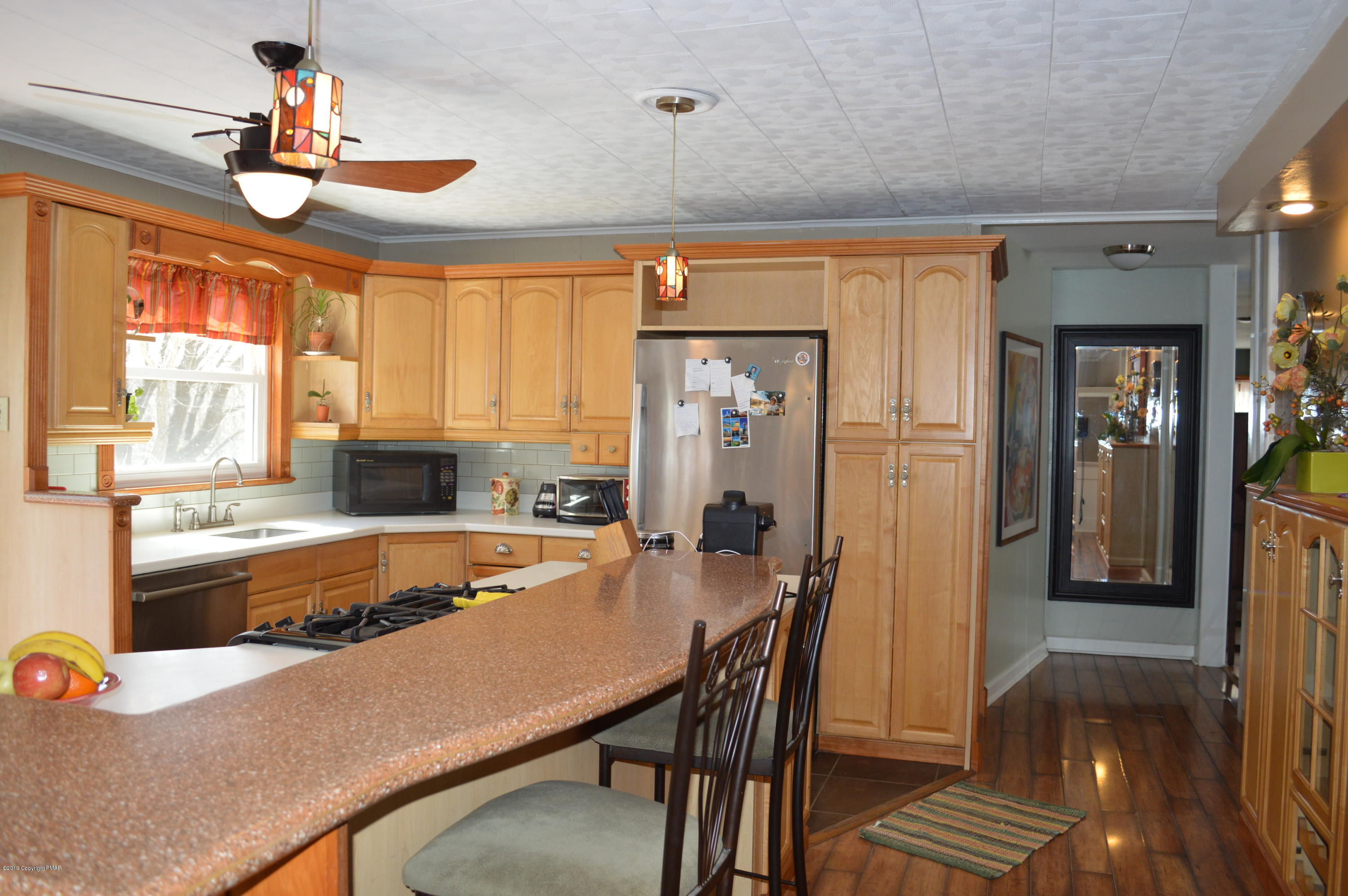 829 Gilbert Road Effort, PA 18330 - Photo 4 of 48 a large kitchen with a table and chairs