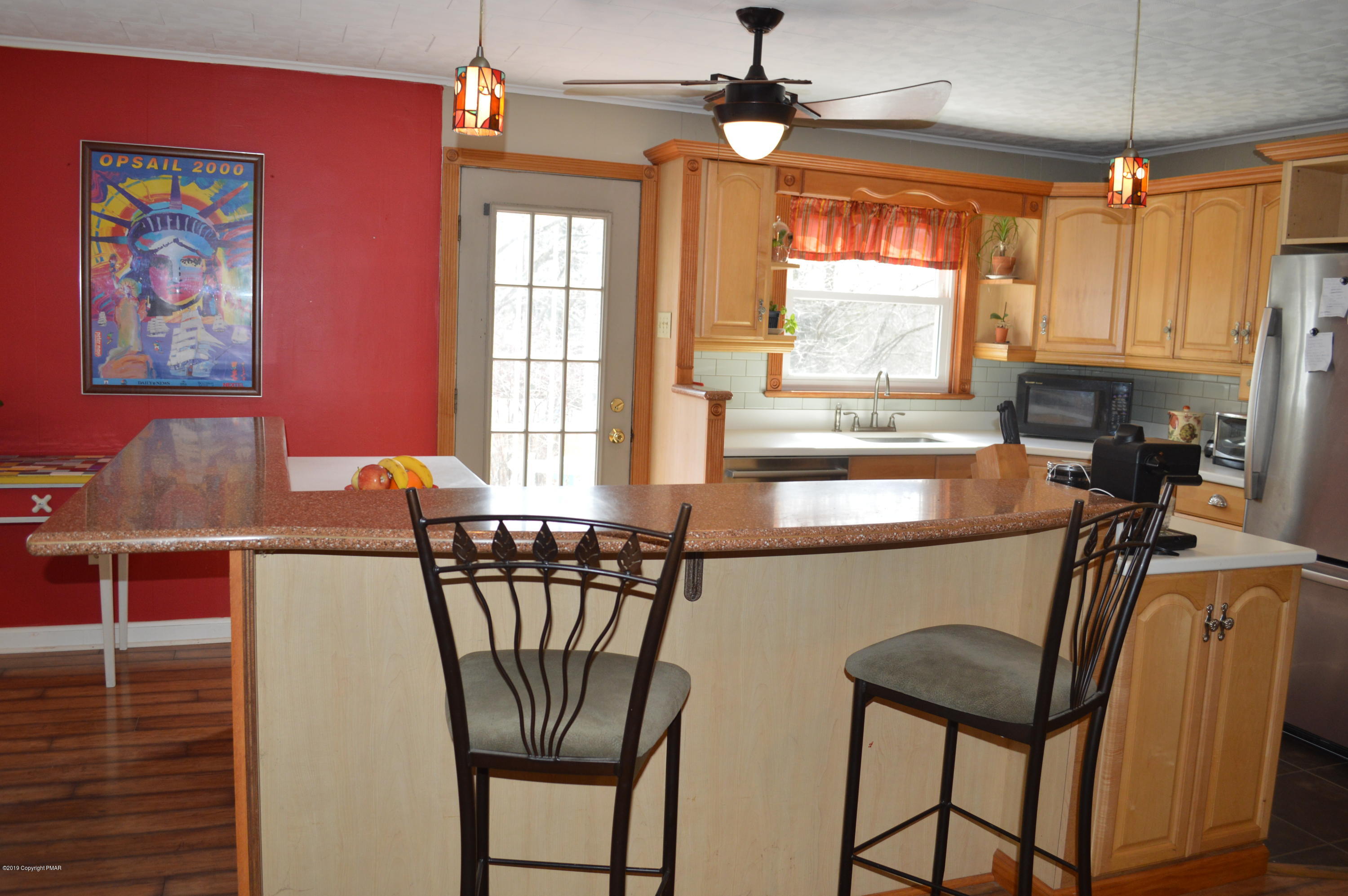 829 Gilbert Road Effort, PA 18330 - Photo 5 of 48 a dining room with furniture a chandelier and window