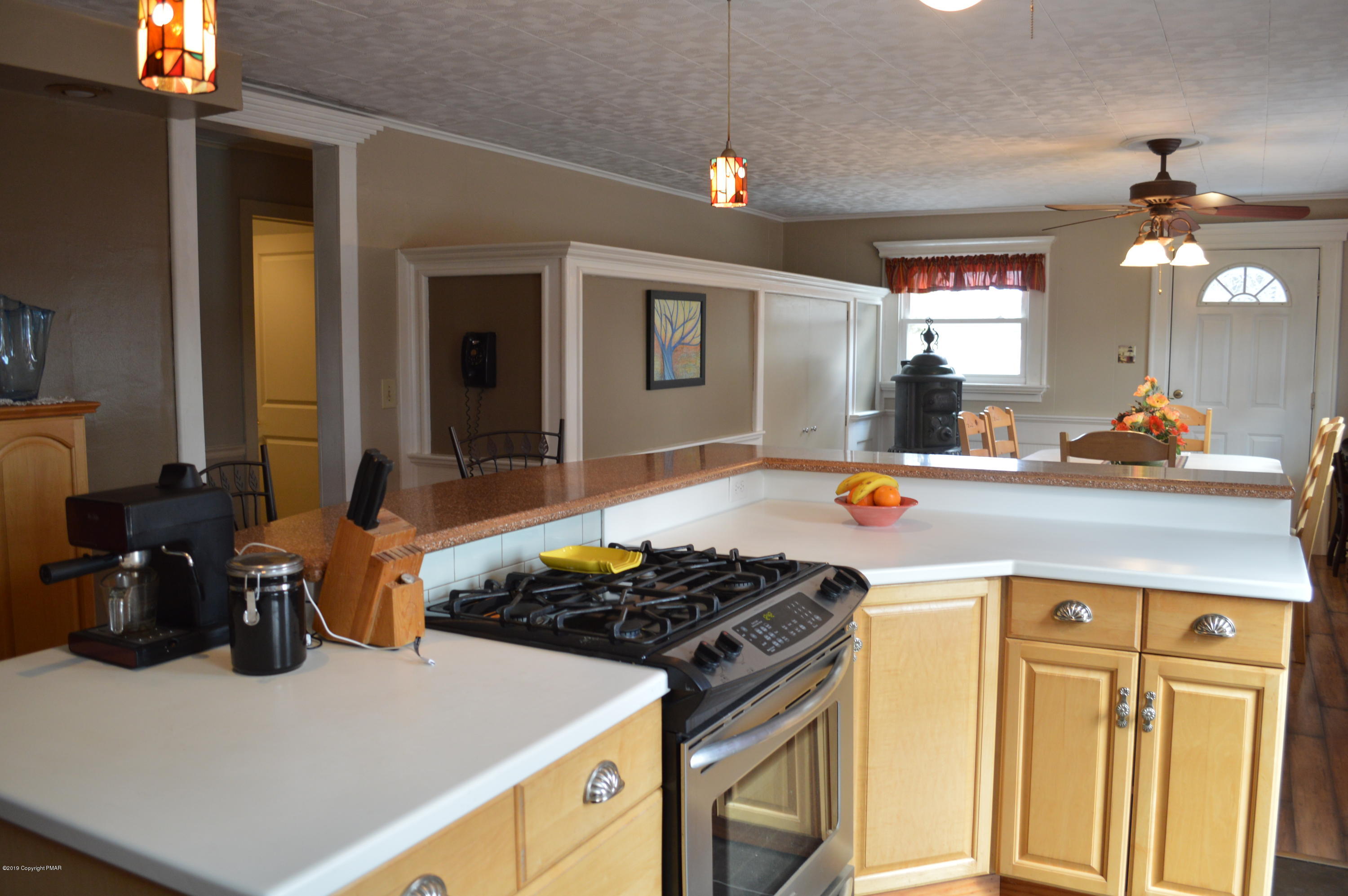829 Gilbert Road Effort, PA 18330 - Photo 7 of 48 a kitchen with a sink stove and cabinets