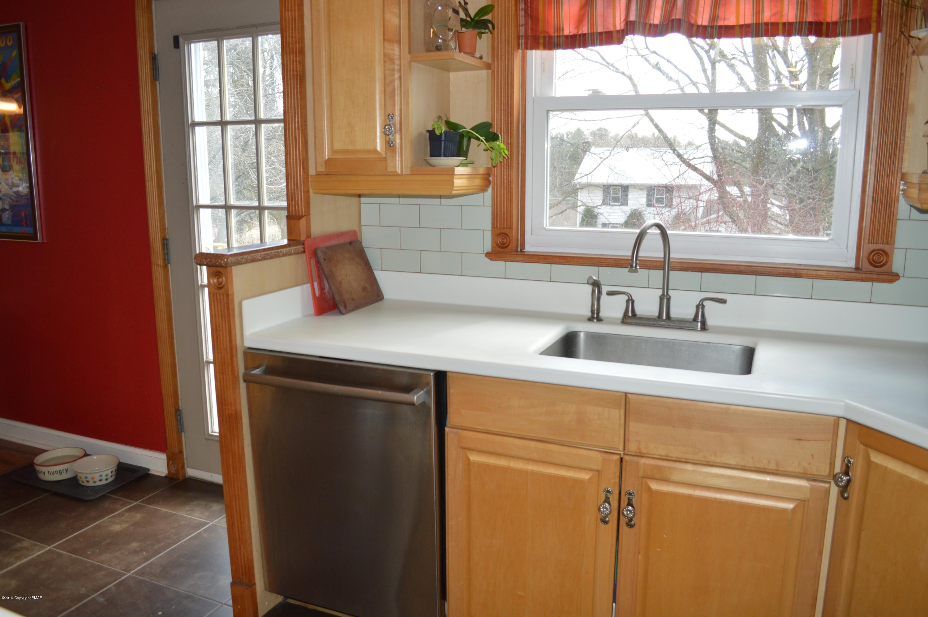 829 Gilbert Road Effort, PA 18330 - Photo 8 of 48 a kitchen with a sink and a window