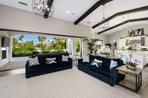 a kitchen with stainless steel appliances granite countertop a refrigerator and a stove