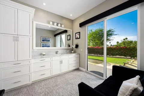 a bedroom with a bed and a night stand