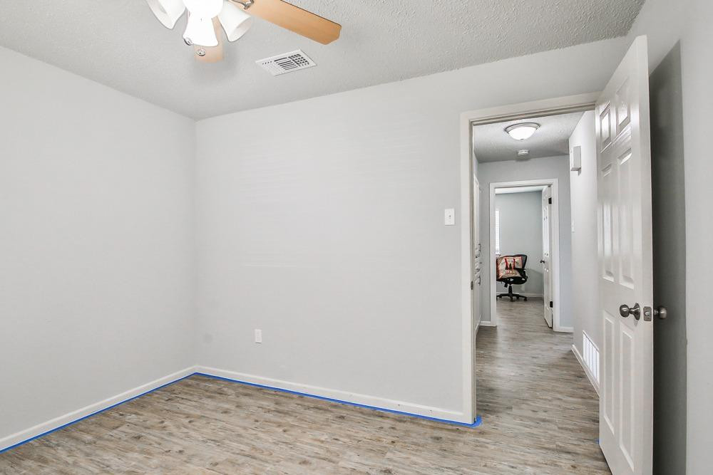 5503 1st Place Lubbock, TX 79416 - Photo 16 of 27 wooden floor in an empty room