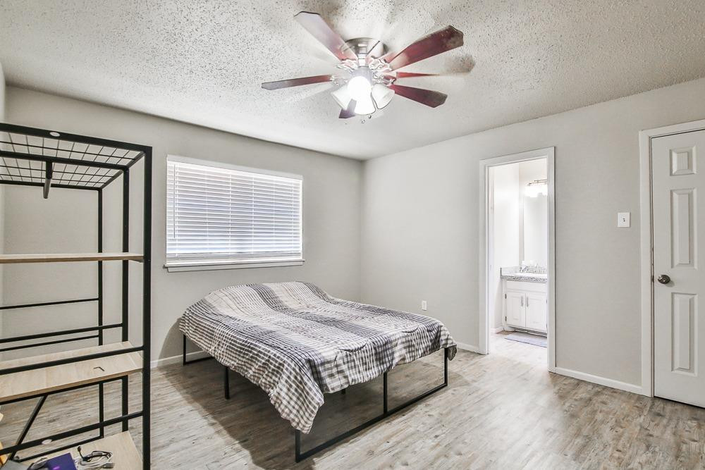5503 1st Place Lubbock, TX 79416 - Photo 19 of 27 a bedroom with a bed and a window