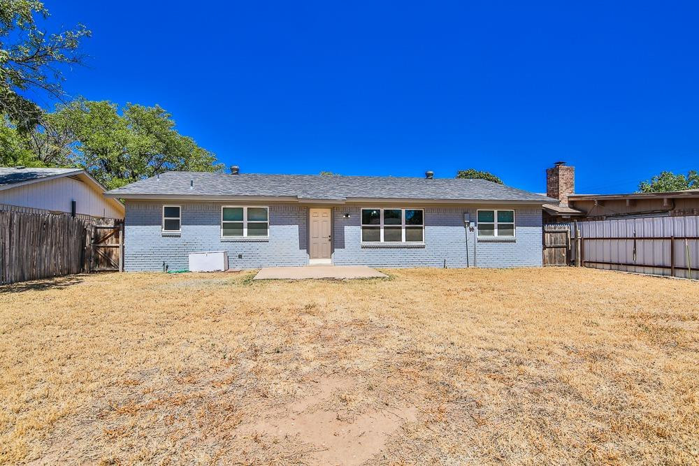 5503 1st Place Lubbock, TX 79416 - Photo 27 of 27 a front view of a house with a yard