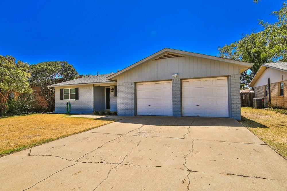 5503 1st Place Lubbock, TX 79416 - Photo 3 of 27 a front view of a house with a yard