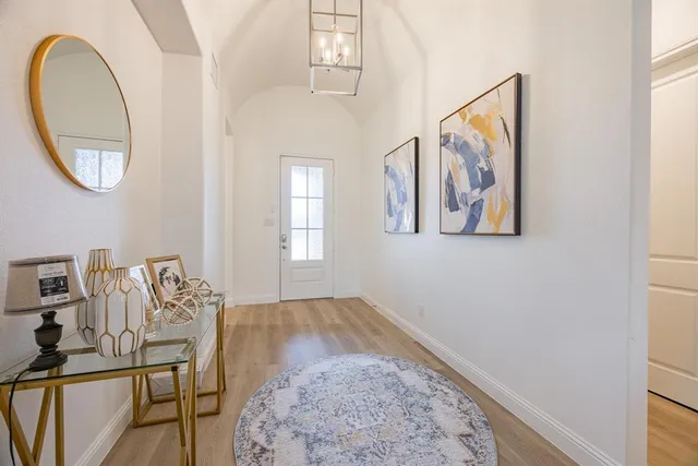 a view of a livingroom with furniture and a window
