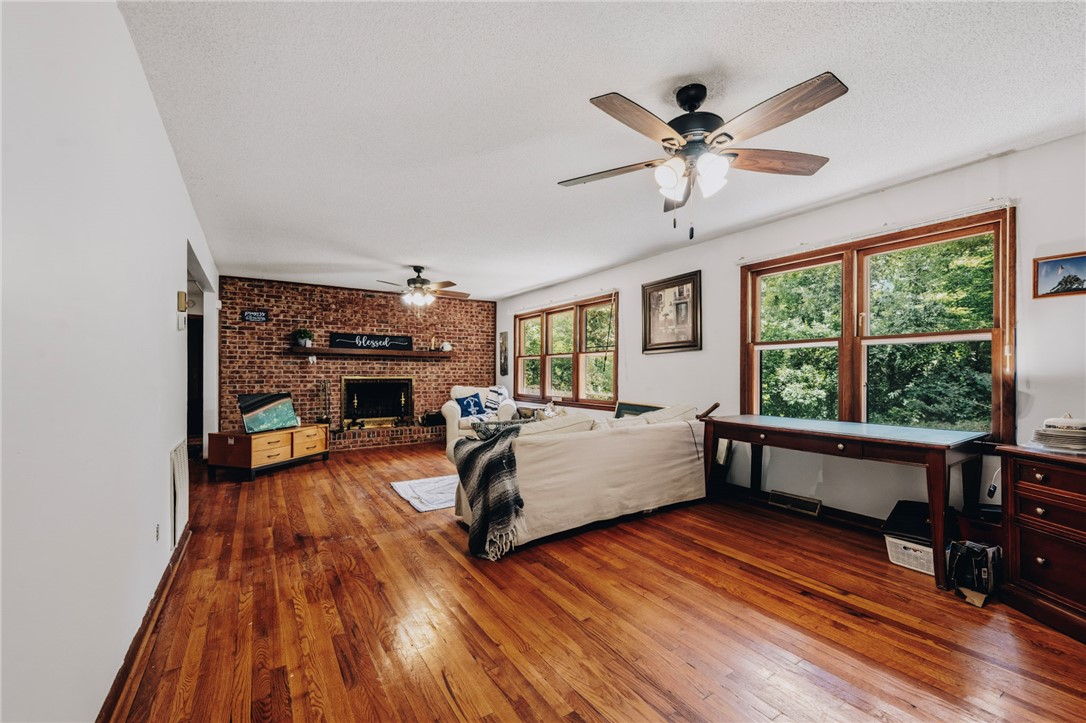 707 Campbell Town Road Walhalla, SC 29691 - Photo 14 of 44 Rich hardwood floors sweep across an open layout anchored by a private reading and writing area