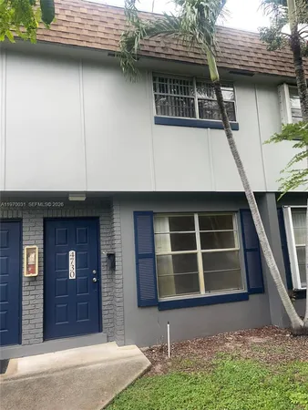 a front view of a house with garage