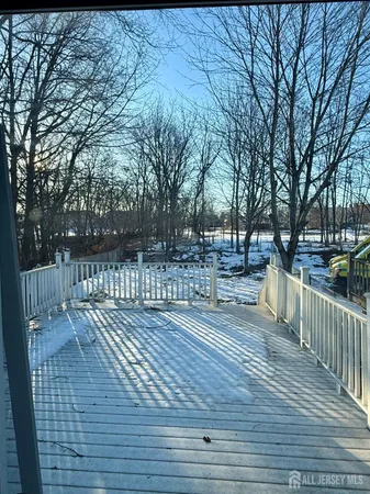 a view of a deck with trees