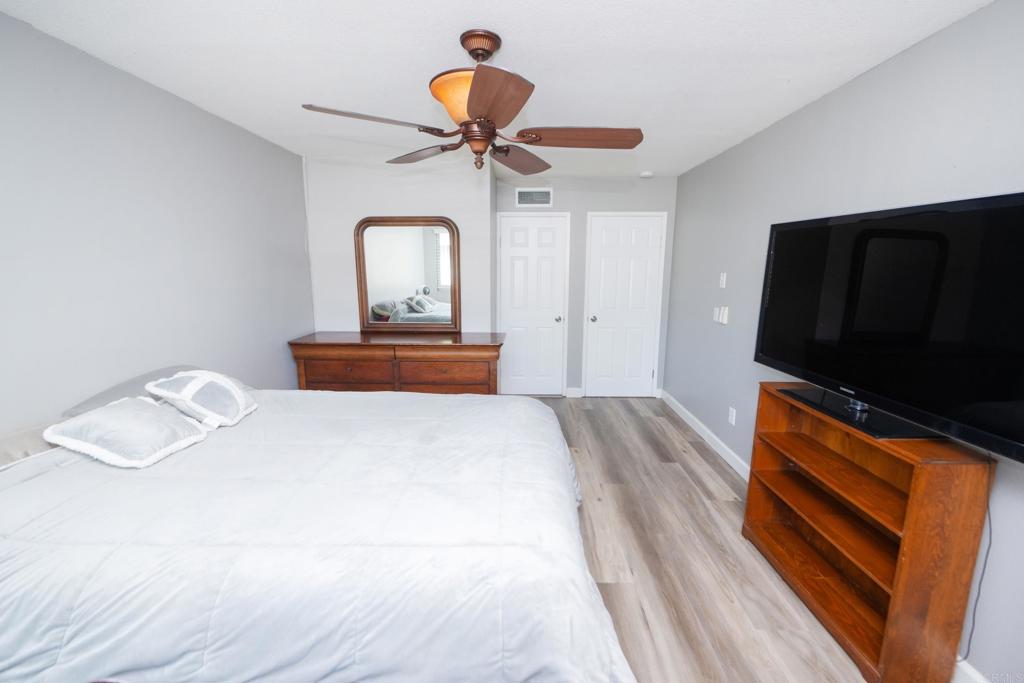 929 Jamacha Road, Unit B El Cajon, CA 92019 - Photo 21 of 36 a bedroom with a bed and a flat screen tv