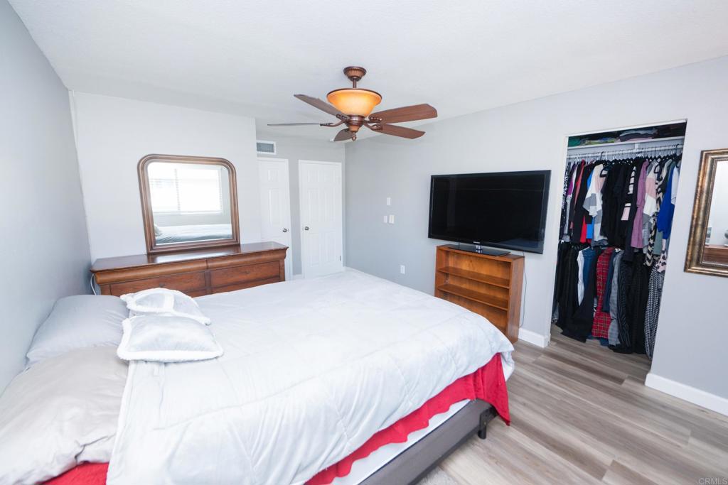 929 Jamacha Road, Unit B El Cajon, CA 92019 - Photo 23 of 36 a bedroom with a bed and a flat screen tv