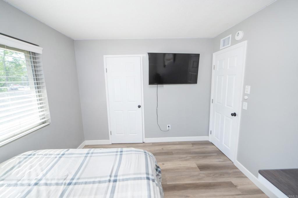 929 Jamacha Road, Unit B El Cajon, CA 92019 - Photo 33 of 36 a view of an empty room with wooden floor and a window