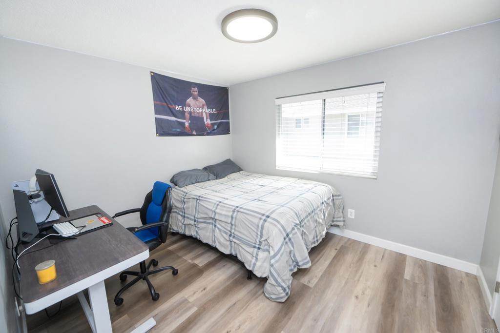 929 Jamacha Road, Unit B El Cajon, CA 92019 - Photo 35 of 36 a bedroom with a bed and a desk