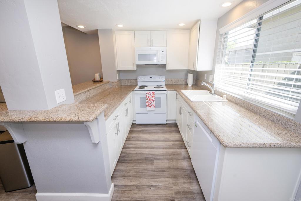929 Jamacha Road, Unit B El Cajon, CA 92019 - Photo 8 of 36 a large kitchen with a stove and a sink