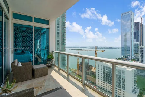 a view of a balcony with furniture
