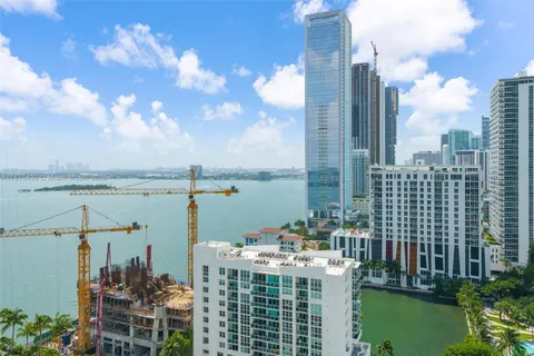 a view of a lake with a multi story building and lake view