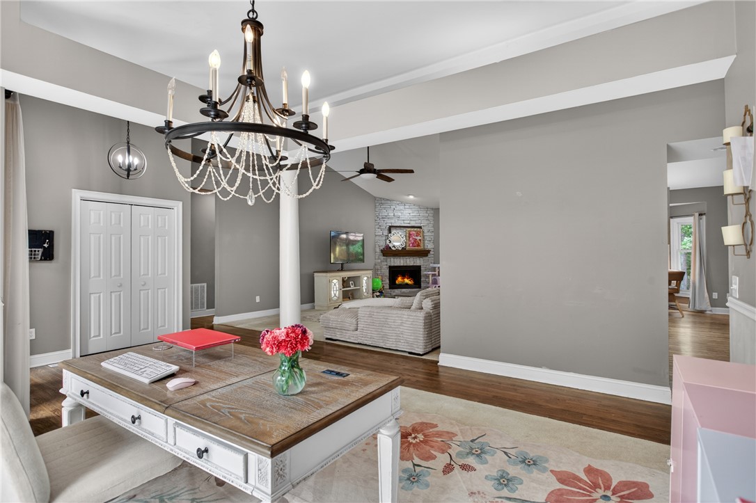 136 Loran Pointe Circle Seneca, SC 29672 - Photo 15 of 50 Elegant chandelier lighting creates a refined atmosphere in this versatile room with hardwood floors.