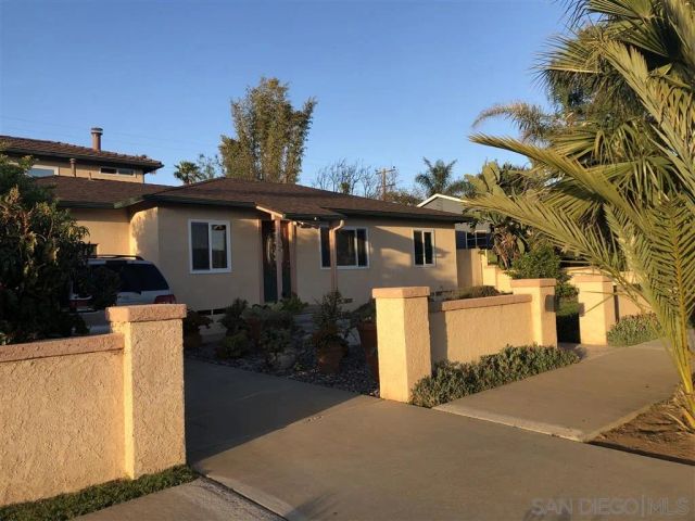 front view of a house with a street
