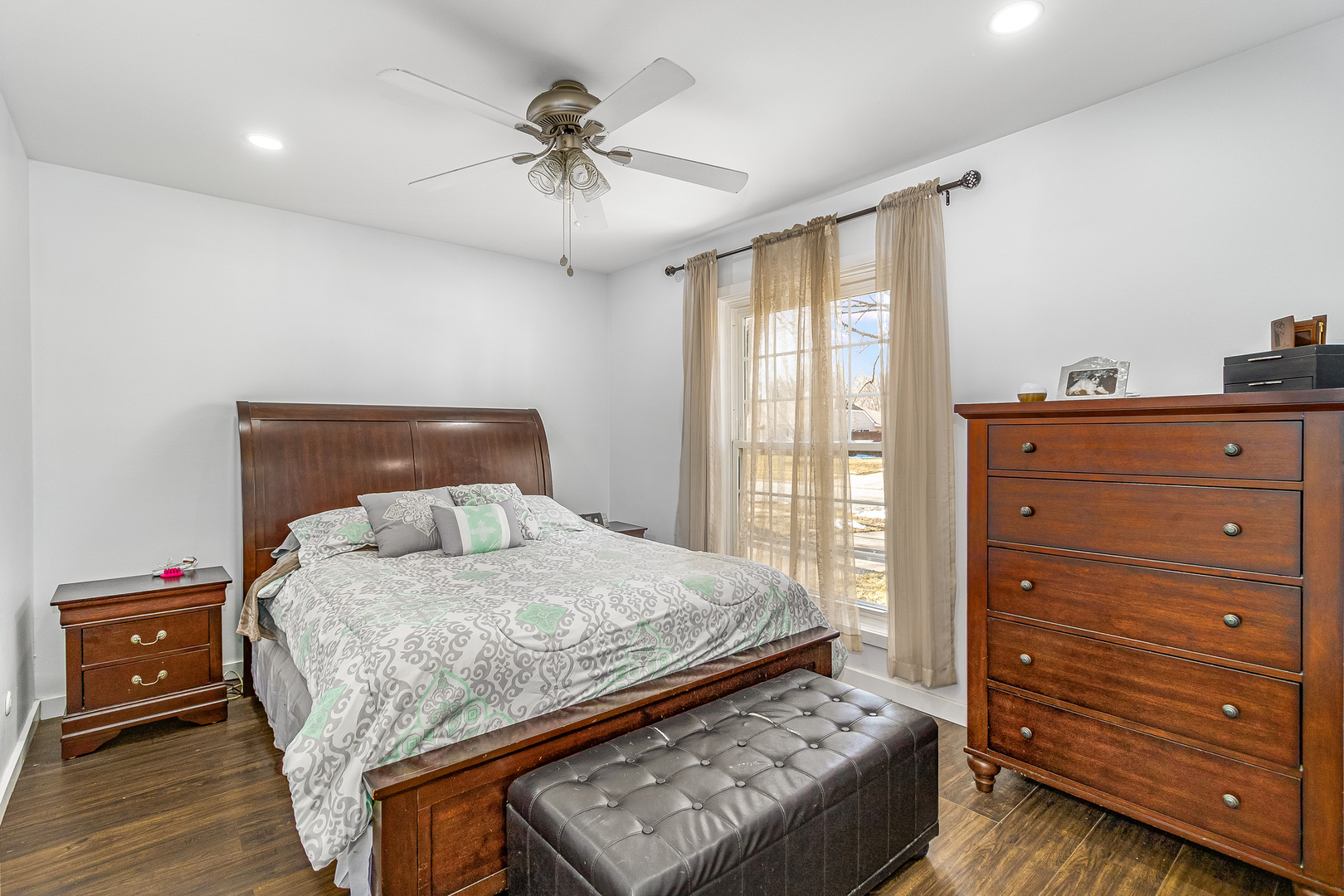 7 Winrock Road Montgomery, IL 60538 - Photo 11 of 24 a bedroom with a bed and wooden floor