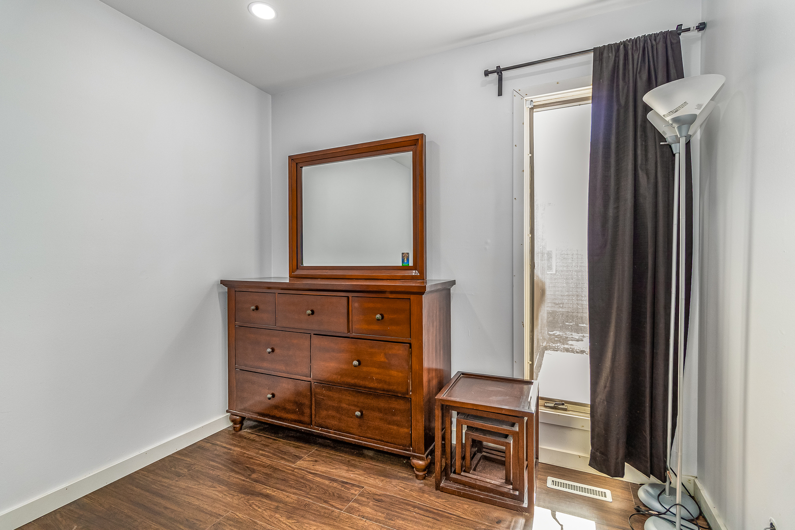 7 Winrock Road Montgomery, IL 60538 - Photo 17 of 24 a room with a dresser and a mirror