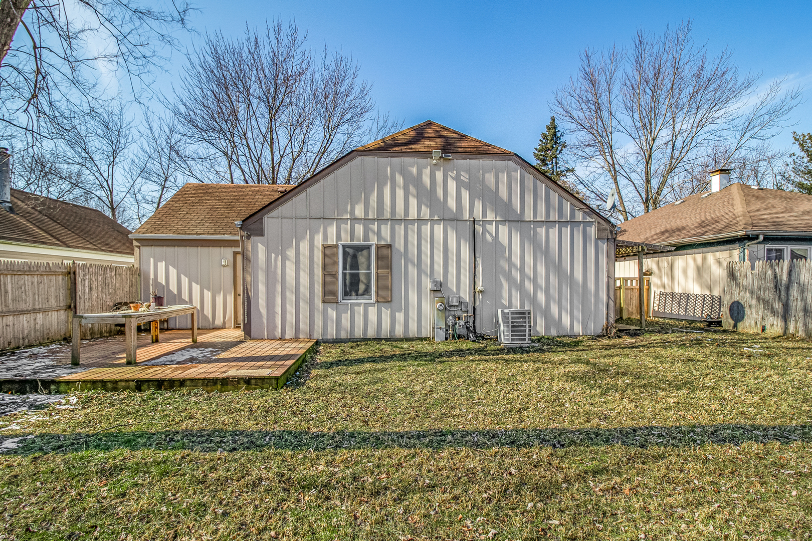 7 Winrock Road Montgomery, IL 60538 - Photo 24 of 24 a backyard of a house with table and chairs