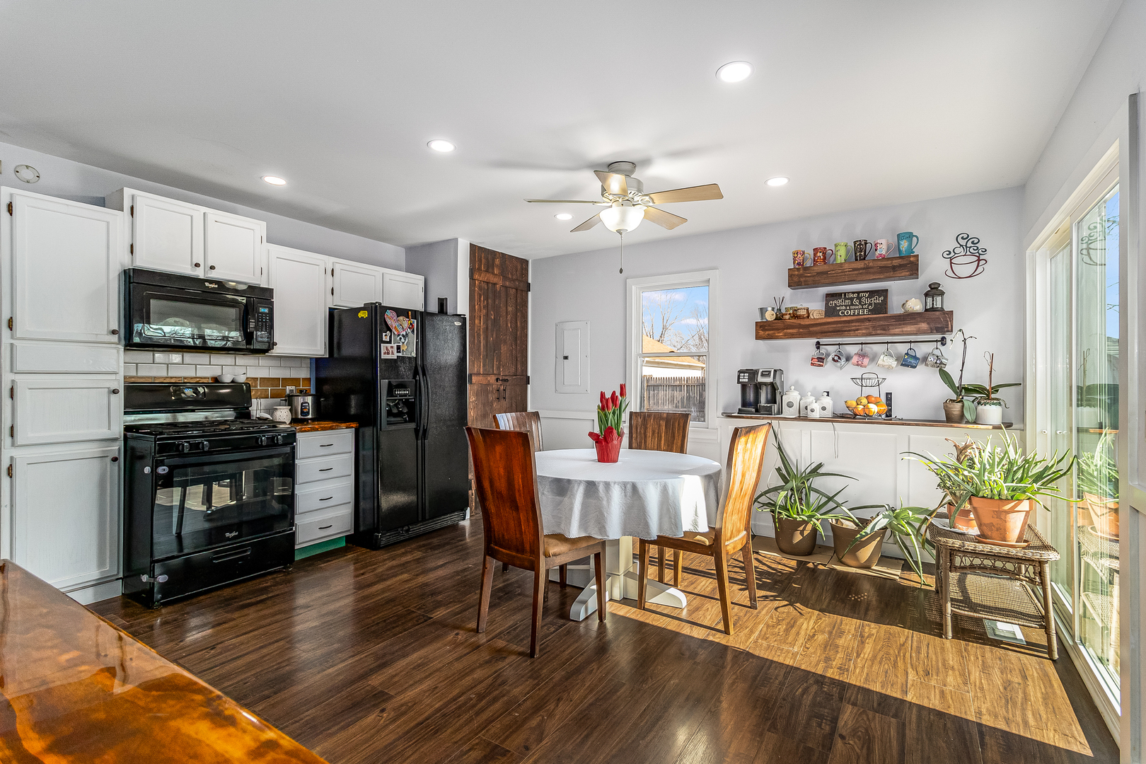 7 Winrock Road Montgomery, IL 60538 - Photo 6 of 24 a view of a dining room with furniture a kitchen and chandelier