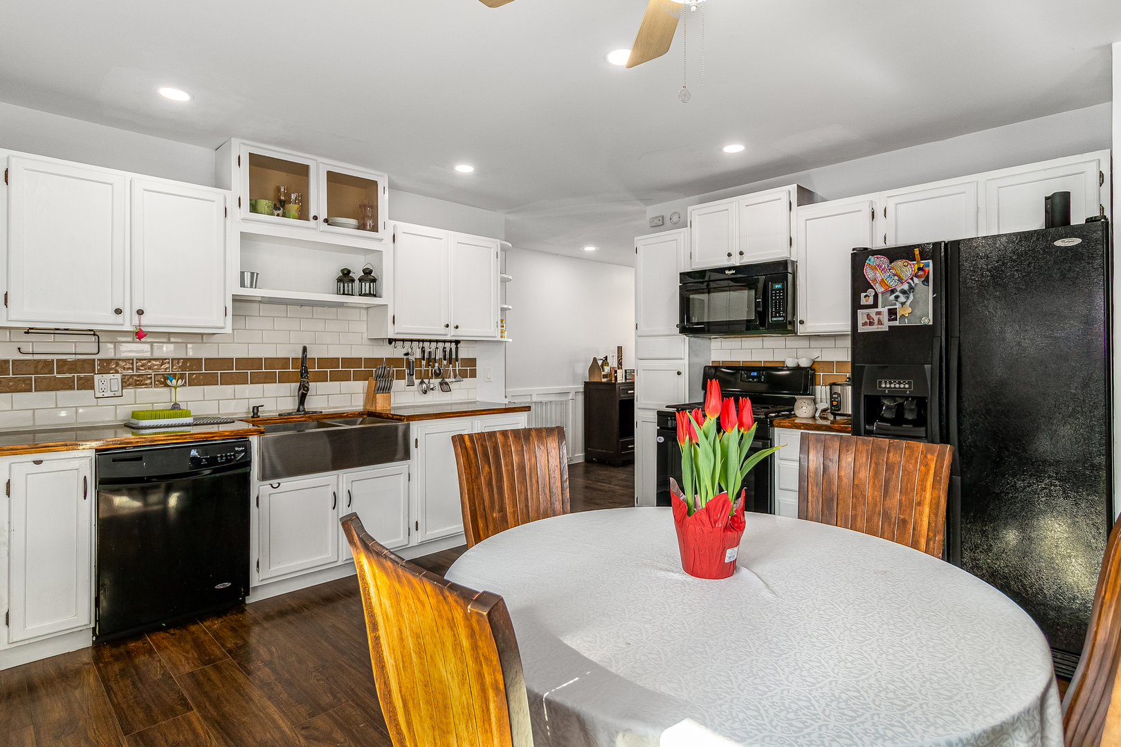 7 Winrock Road Montgomery, IL 60538 - Photo 7 of 24 a kitchen with stainless steel appliances kitchen island granite countertop a refrigerator a stove top oven a dining table and chairs