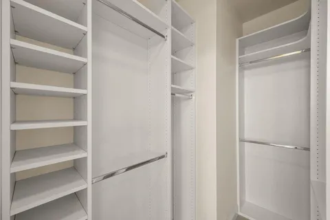 a kitchen with a cabinets and white appliances