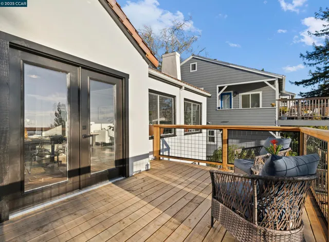 a balcony view with a seating space