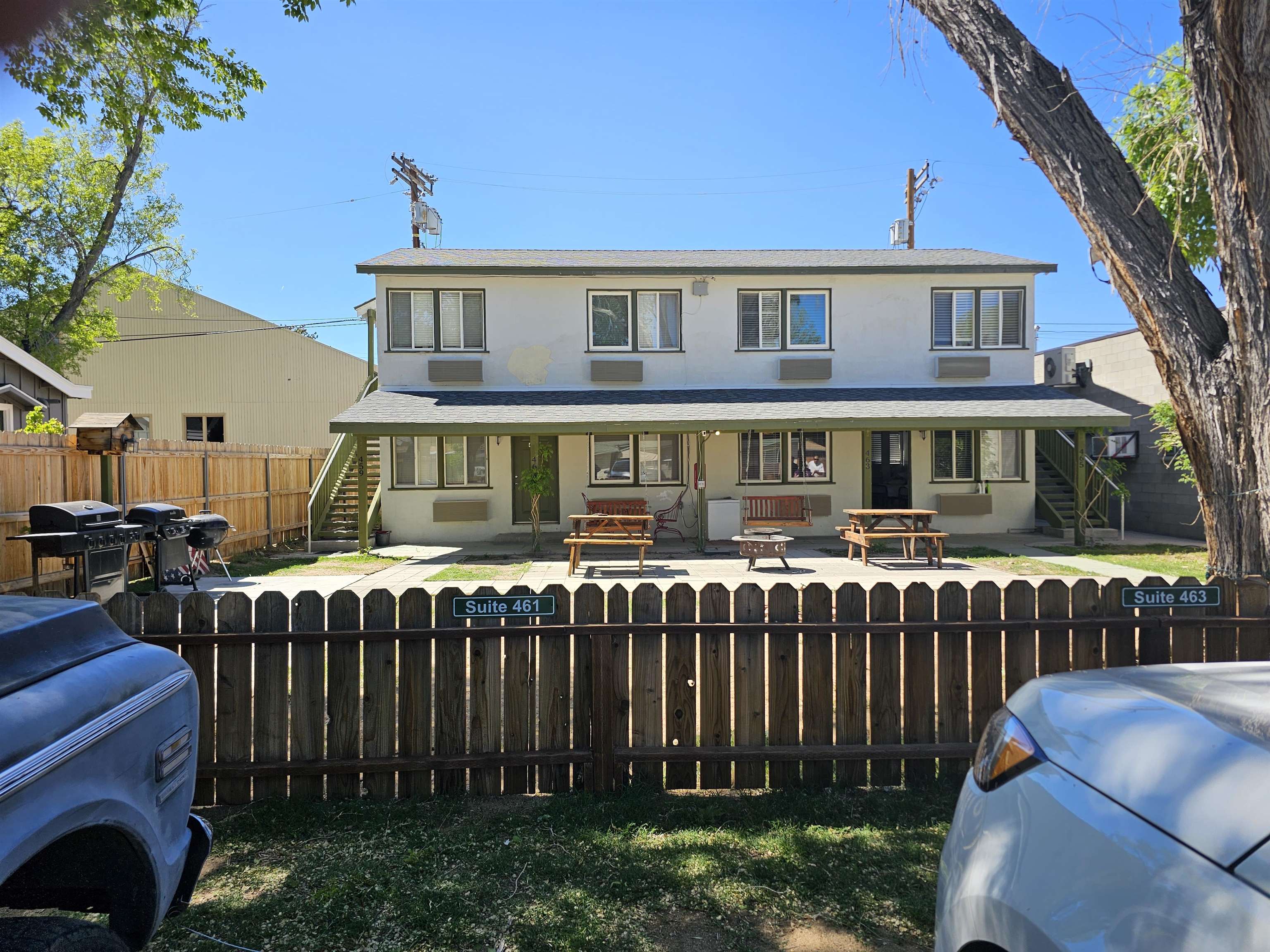 461 High Street Bishop, CA 93514 - Photo 2 of 10 Two-story property with a light-colored exterior and dark trim