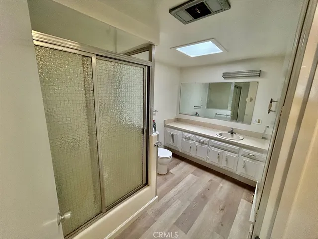 a bathroom with a double vanity sink and mirror