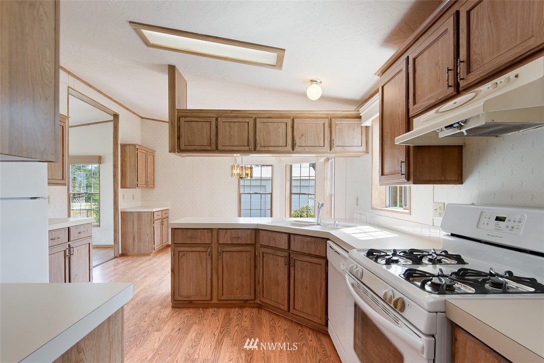 17855 Bennett Road Mount Vernon, WA 98273 - Photo 15 of 40 a kitchen with stainless steel appliances a stove a sink and a refrigerator