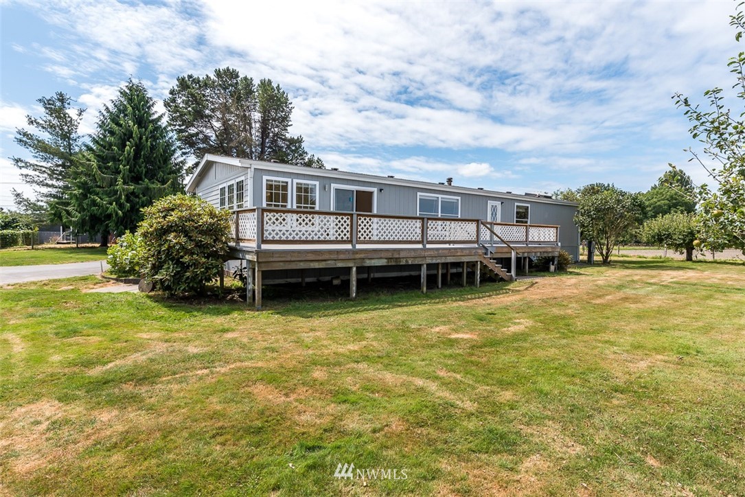 17855 Bennett Road Mount Vernon, WA 98273 - Photo 32 of 40 a backyard of a house with a garden and outdoor seating