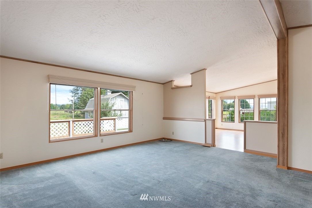 17855 Bennett Road Mount Vernon, WA 98273 - Photo 5 of 40 an empty room with windows and mountain view