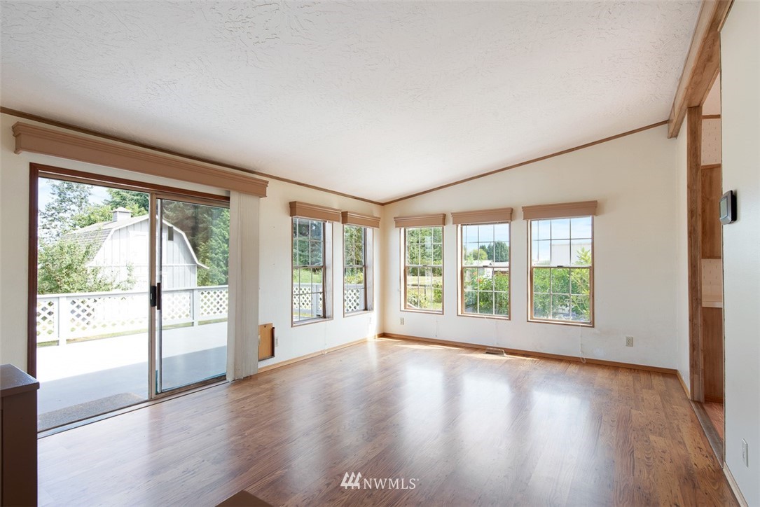17855 Bennett Road Mount Vernon, WA 98273 - Photo 8 of 40 a view of an empty room with wooden floor and a window