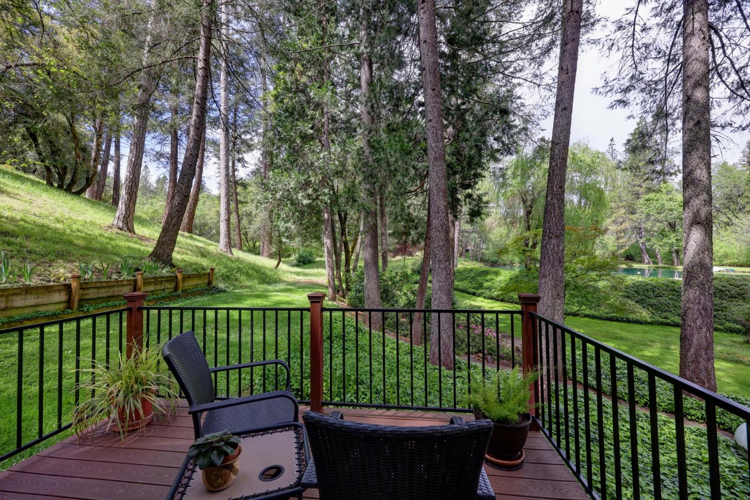 409 Live Oak Road Colfax, CA 95713 - Photo 27 of 74 Private primary suite deck with a wonderful pond view.
