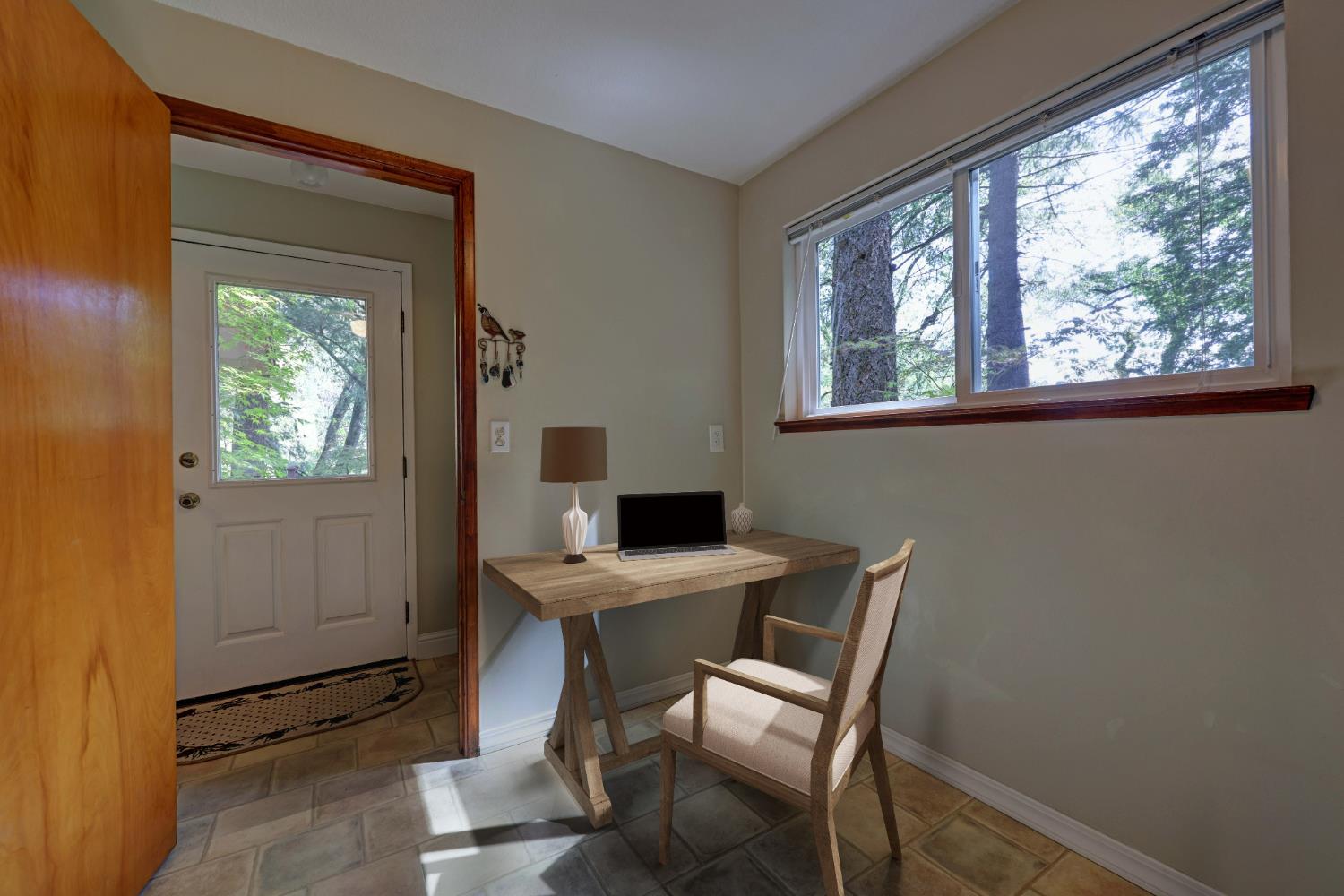 409 Live Oak Road Colfax, CA 95713 - Photo 38 of 74 Sellers had a desk in this little nook of the laundry room and found it to be very convenient, and out of the way.