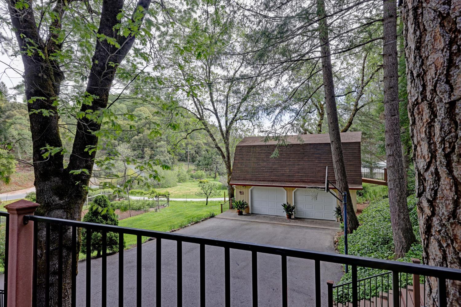 409 Live Oak Road Colfax, CA 95713 - Photo 45 of 74 Across the driveway from the house is the detached 2 car garage with finished space above.