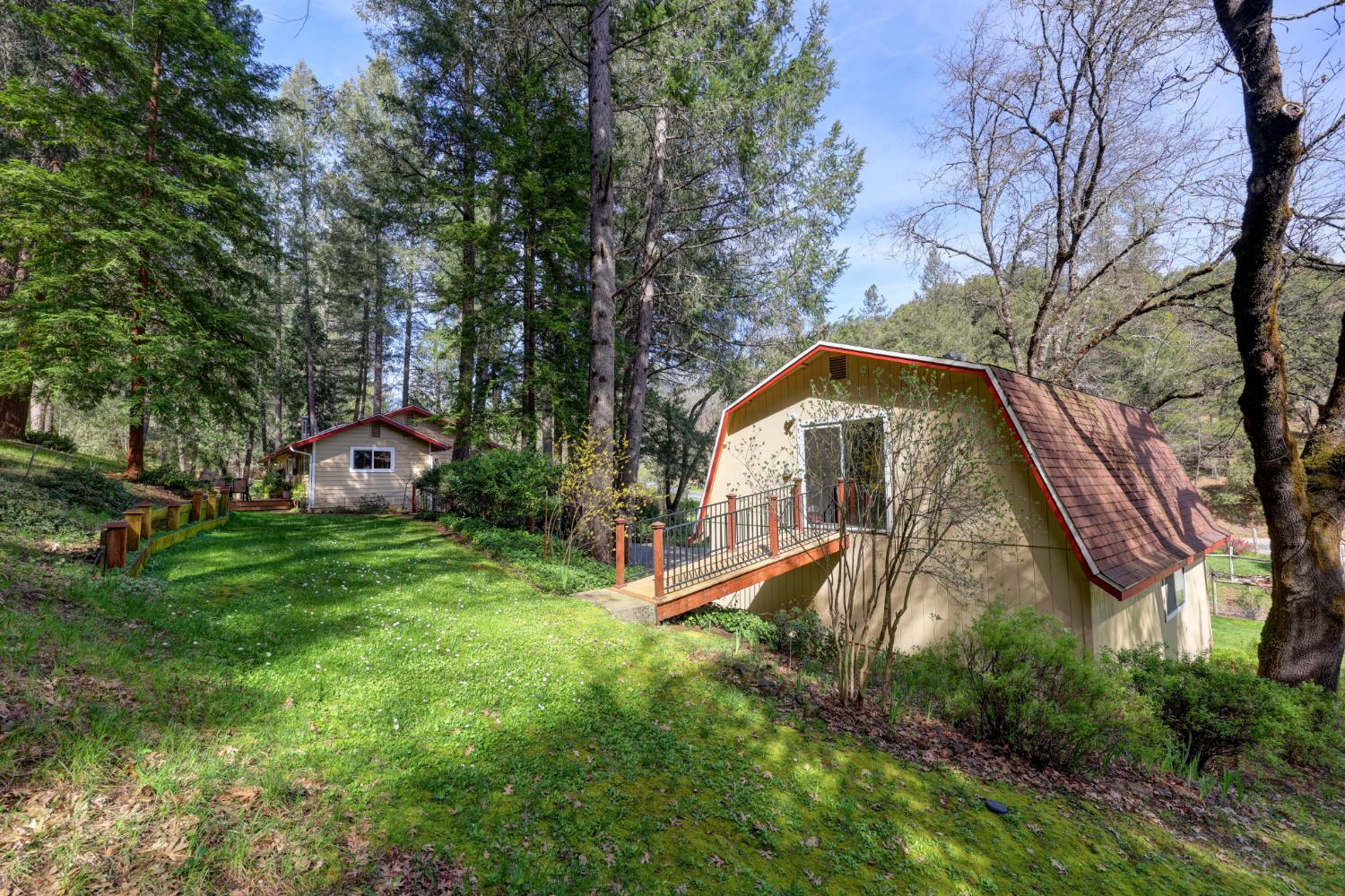 409 Live Oak Road Colfax, CA 95713 - Photo 46 of 74 Walk over from the house and access the 2nd floor acoss this walkway. Or occassionaly drive up the side of the garage when needed.